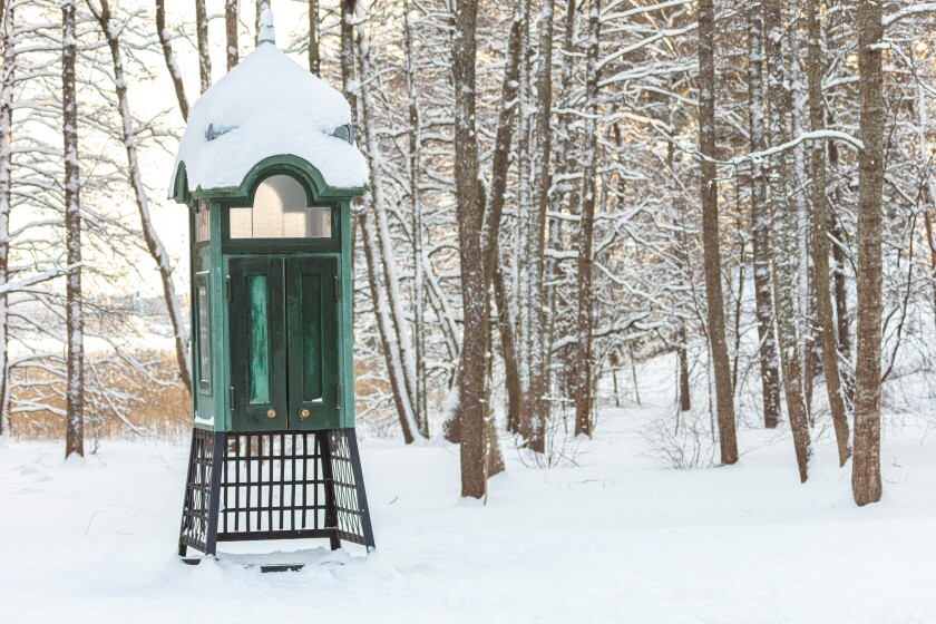 An old wooden telephone booth. architecture of Finland. Seurasaari, Helsinki