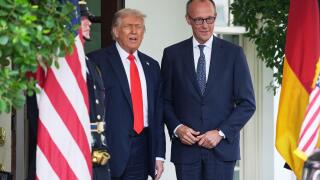 President Donald Trump, left, greets Germany's Chancellor Friedrich Merz at the White House, Thursday, June 5, 2025, in Washington. (AP Photo/Evan Vucci)