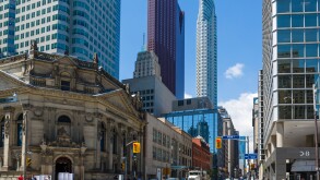 View down Yonge Street at intersection with Front Street in financial district with Hockey Hall of Fame to left, Toronto, Canada
