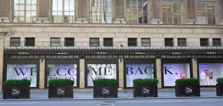 Saks Fifth Avenue department store welcome back sign in windows for reopening in Phase 3 during COVID-19 pandemic, Midtown, Manhattan, New York City, USA July 2020