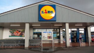 Exterior view of supermarket Lidl store shopping trollies carts and sign in Cardiff Wales UK  Great Britain  KATHY DEWITT