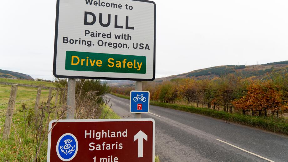 Road sign at Scottish village called Dull near Aberfeldy in Perthshire, Scotland , UK