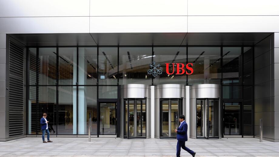 Entrance of 5 Broadgate UBS building exterior HQ headquarters sign people  financial services investment bank in the City of London UK   KATHY DEWITT