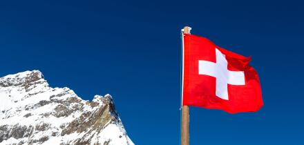 Swiss flag at the top of Jungfraujoch Plateau, Jungfrau Peak, Switzerland