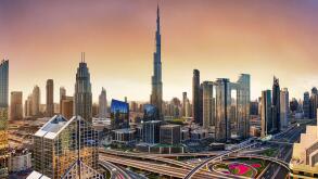Dubai skyline at sunset with Burj Khalifa - aerial view, United Arab Emirates