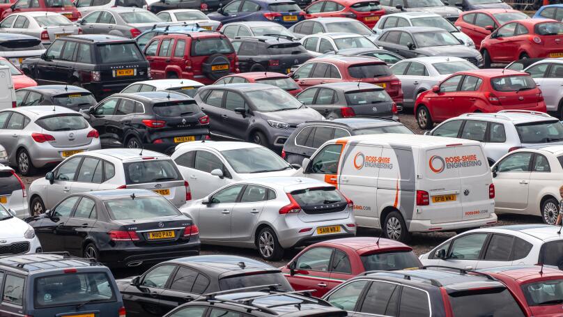 Elevated view of vehicles (Cars and a van) parked in a car park at Ardrossan Harbour, North Ayrshire, Scotland, UK