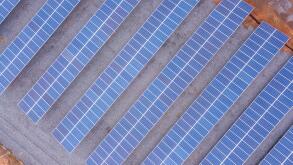Aerial view of solar panels in factory using clean and renewable energy. Drone shot in the state of Mato Grosso, Brazil. Environment concept, zero car