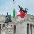 Italy flag city landmark, view of the national flag of Italy sited at the Vittorio Emanuele Monument in the historic centre of Rome, Italy