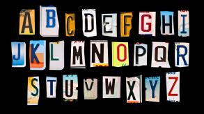 Alphabet set created with broken pieces of vintage car license plates