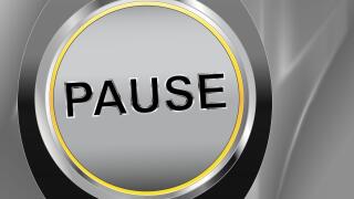 Button Pause on silver background