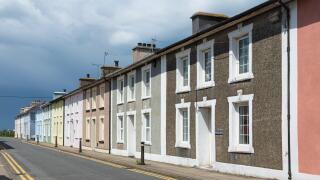 The picturesque Georgian town of Aberaeron on the Cardigan Bay coast in Ceredigion, Wales, UK, with brightly painted town houses.