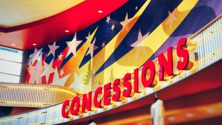 Concessions sign in mega screen movie theater in US