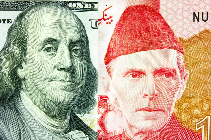 Banknotes 100 US dollars and 100 Pakistani rupees-adobe