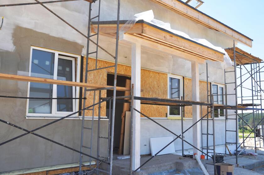 House entrance under painting, plastering and constuction outdoor.