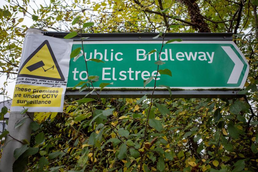 Public Bridleway sign near Elstree, Hertforshire, with notice about CCTV to deter fly-tipping