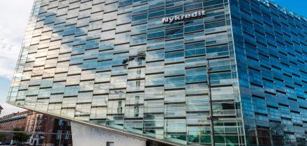 Copenhagen, Denmark - August 27, 2019: Low angle shot of The Crystal (Krystallen) designed by Schmidt Hammer Lassen, modern office building of the Nyk