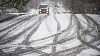 Car on road during snowstorm in Seattle Washington USA. Image shot 2009. Exact date unknown.
