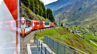 Zermatt 24,5,2023: Glacier Express red swiss train in Swiss Alps.Zermatt to St.Moritz. Switzerland in summer