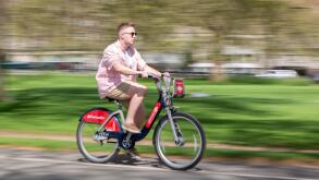 Cyclist using Santander Cycle Hire Scheme, London, UK