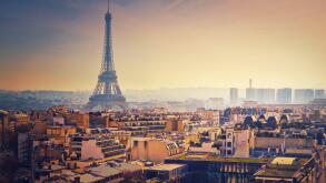Smog over Paris city, France. Foggy sunset view to the Eiffel Tower due high level of pollution caused by busy urban traffic