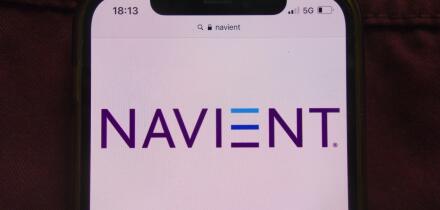 KONSKIE, POLAND - February 22, 2022: Navient Corporation logo displayed on mobile phone hidden in jeans pocket