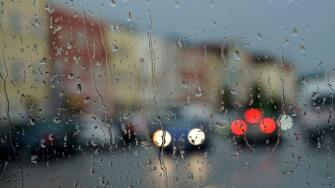 germany,bavaria,upper bavaria,neuotting,rainy weather,window pane,raindrops,traffic,unclear