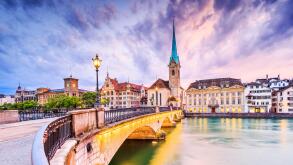 Zurich, Switzerland. View of the historic city center with famous Fraumunster Church, on the Limmat river.
