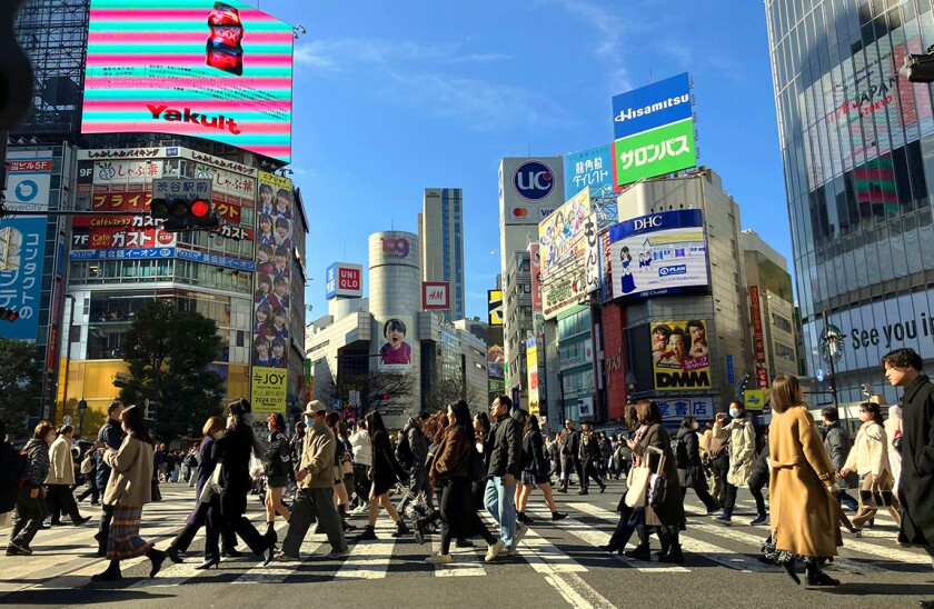 People cross Shibuya Scramble Crossing in Tokyo on Jan. 30, 2024. ( The Yomiuri Shimbun via AP Images )