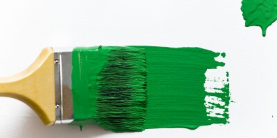 Green paint and brush