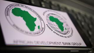 Viersen, Germany - January 9. 2022: Closeup of mobile phone with logo lettering of african development bank on computer keyboard