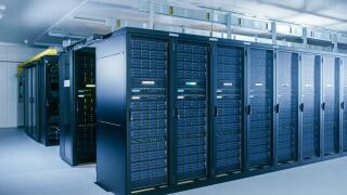 Shot of Data Center With Multiple Rows of Fully Operational Server Racks. Modern Telecommunications, Cloud Computing, Artificial Intelligence