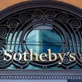 Sign and logo at the entrance to the Sotheby's building in Geneva. Sotheby's is a multinational company specializing in fine art and luxury objects