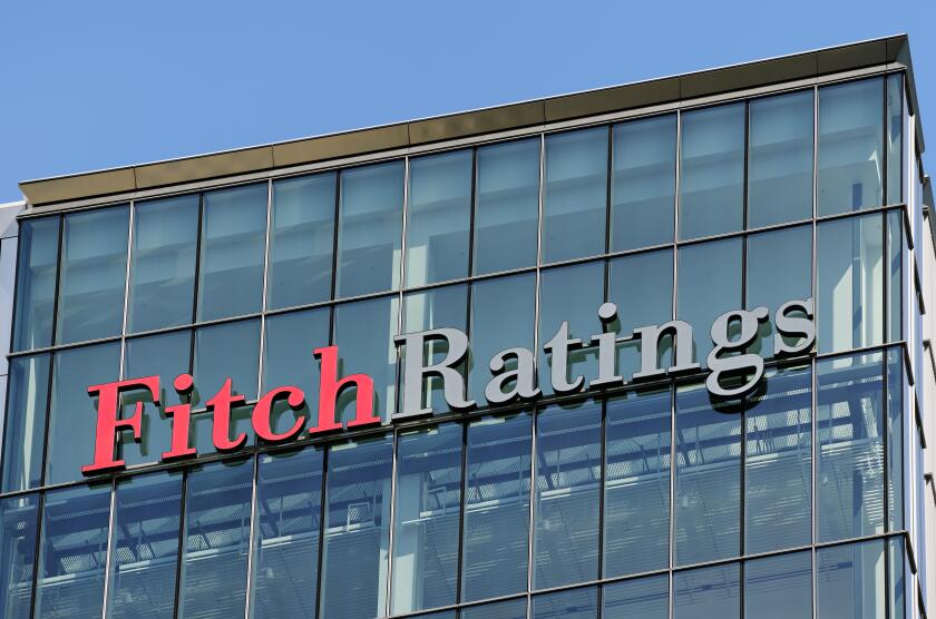 Fitch Ratings Sign on its Office Building, Canary Wharf, London, UK.