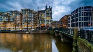 Buildings and bridge over the Singel Canal, in Amsterdam, The Netherlands.