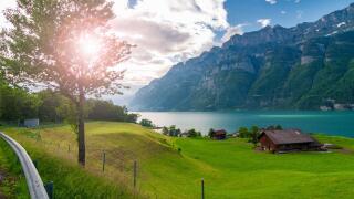 Beautiful lake in Switzerland. Sunny morning at the Swiss countryside.