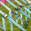 Row of tension tightening straps and pulleys on a large marquee