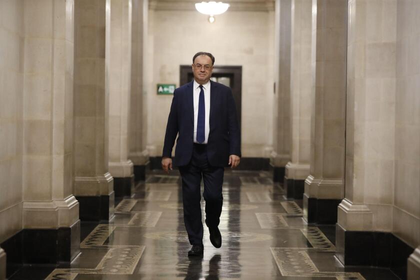 The new Governor of the Bank of England, Andrew Bailey, during a photo call on his first day inside the central bank's headquarters in London.