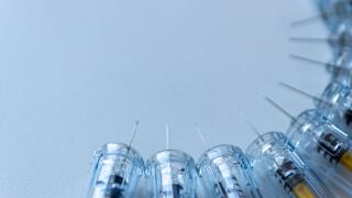 New medical vaccines ready for injection with syringe and vaccine to inject the cure for immunization into ill weak patients to heal their suffers and illnesses thrombosis prevention after operation