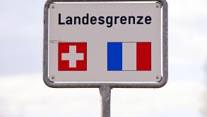 Sign National border with flags Switzerland, France. Image shot 2020. Exact date unknown.