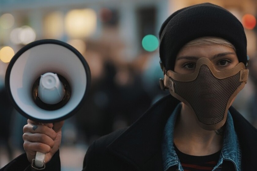 Protest megaphone racism from Alamy 5May21 575x375