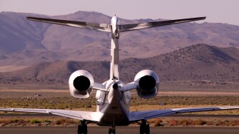 Rear view of Executive Jet on air strip apron in Nevada USA