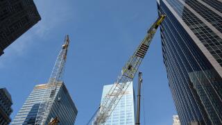 Cranes Working on Construction of a New Building
