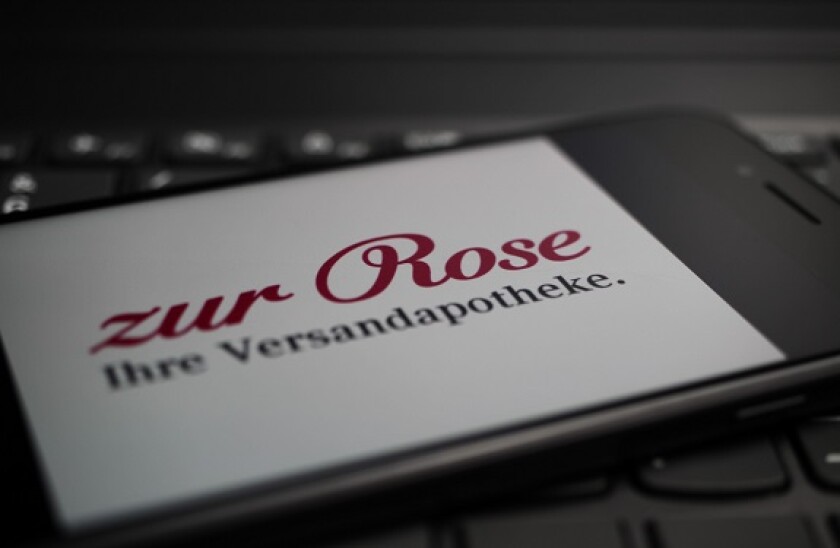 Viersen, Germany - May 9. 2020: Close up of mobile phone screen on computer keyboard with logo lettering of german online mail-order pharmacy zur Rose