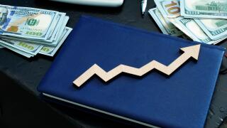 Wealth management concept. Money and arrow on the note.