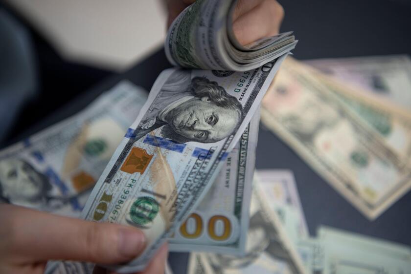 HAIAN, CHINA - JUNE 16, 2022 - A staff member counts US dollar notes at a bank in Haian City, East China's Jiangsu Province, June 16, 2022. The US Fed