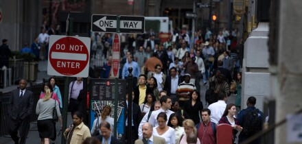Looking west along Wall Street during the morning rush hour by the New York Stock Exchange in Manhattan. Image shot 2007. Exact date unknown.