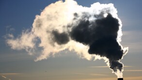 Pollution. Thick smoke from the chimney in winter morning.