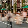 TOKYO, JAPAN - JULY 30 2023: Long exposure motion blurred image of shoppers in the high-end shopping area of Ginza in central Tokyo, Japan