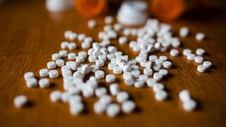 Close-up of pills and bottles on table