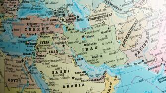 Middle East map on a globe focused on Iran, Turkmenistan, Afghanistan